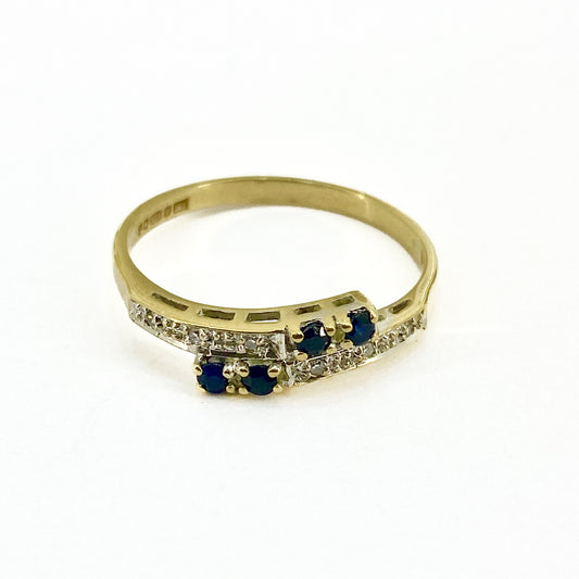 PLR188 Preloved 9ct Y/G Sapphire/diamond Crossover ring Size O1/2    1.6grms